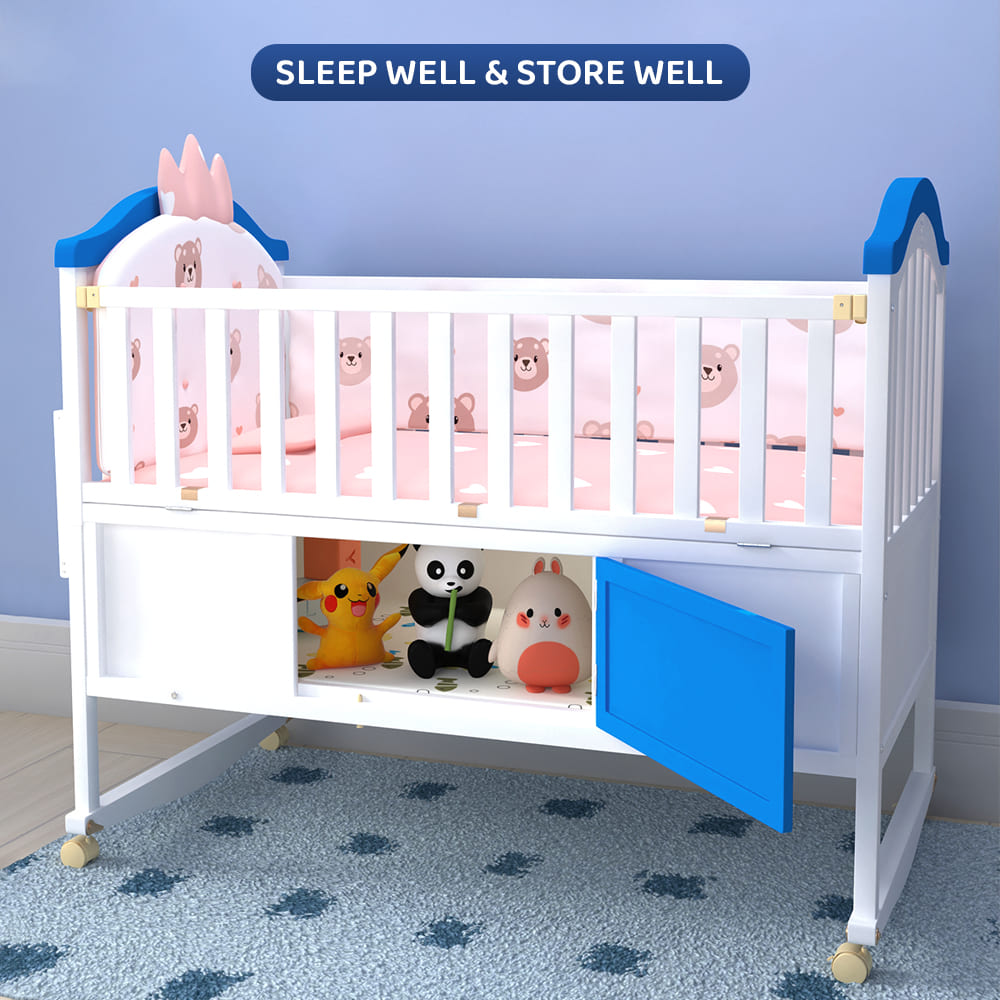 https://staranddaisy.in/wp-content/uploads/2022/12/baby-wooden-cot-with-swing-blue-white-4.jpg